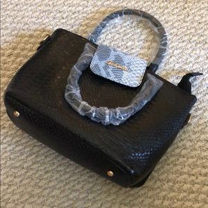 Luboilu unused black snakeskin purse.